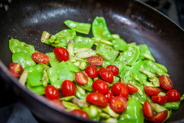 peas and tomatoes on pan