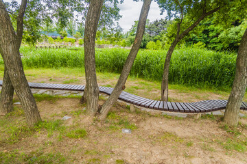 Curved park bench in public park