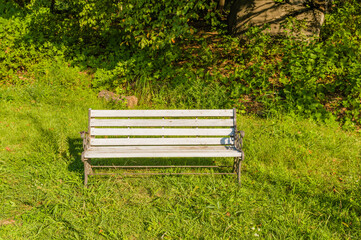 Old white wooden park bench