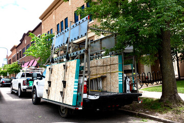 ST PAUL, MINNESOTA / USA - MAY 29, 2020: Truck containing boards to cover store windows against possible rioting due to the police killing by.