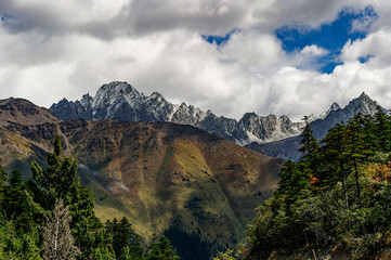 The snow-capped mountains at the riverside of the Brahmaputra river