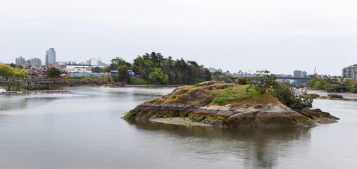 Fototapeta premium Tide lines etched into the granite face of Halkett Island burial ground. A teeny atoll in the upper harbour of Victoria British Columbia on Vancouver Island. 