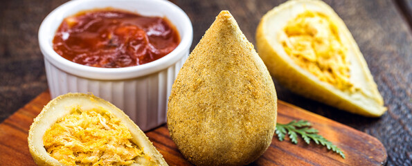 traditional Brazilian fried chicken leg with ketchup. 