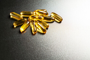 Close-up of omega-3 on a dark background