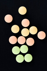 a group of multicolored tablets