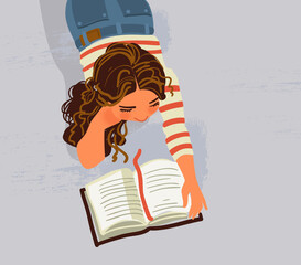 Cute girl reads a book