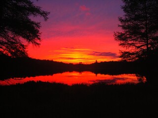 Sunset over an Adirondack pond in Old Forge New York