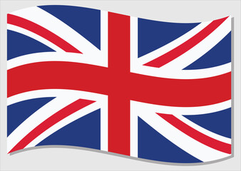 Waving flag of United Kingdom vector graphic. Waving British flag illustration. United Kingdom country flag wavin in the wind is a symbol of freedom and independence.