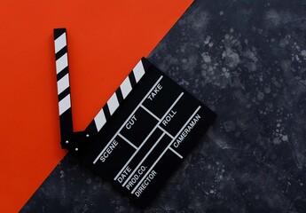 Filmmaking concept. Movie Clapperboard. Cinema begins with movie clappers. Movie clapper on a dark...