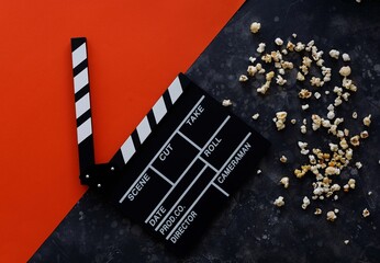 Filmmaking concept. Movie Clapperboard. Cinema begins with movie clappers. Movie clapper on a dark...