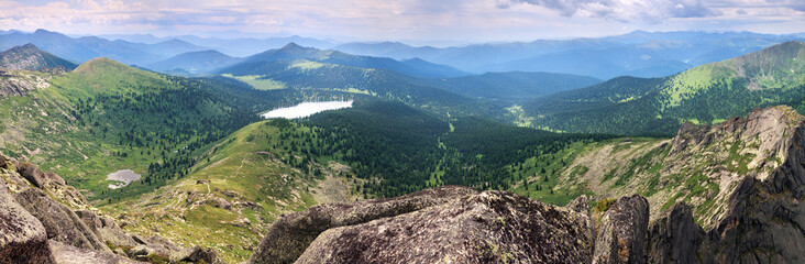 Expanse of the Sayan Mountains, Natural Park Ergaki. Siberian nature, traveling in Russia. Wide panoramic view.