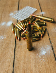 17HMR and .308 Ammunition on board surrounded by powder