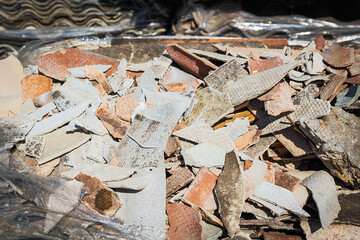 Asbestos landfill . Roof covering material with asbestos fiber . Asbestos roof removal . Dangerous asbestos dust and fiber in the environment . Health problems