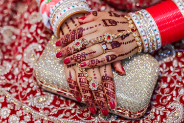 Indian Hindu bride is wearing her jewellery close up