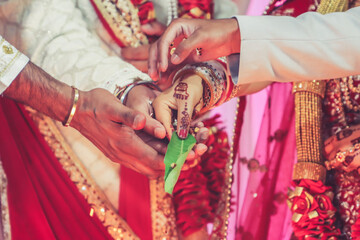 Indian Hindu wedding ceremony and pooja ritual items, hands, and decorations close ups