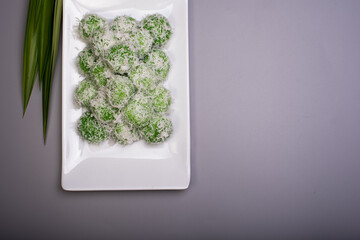 A set of traditional confectionery famous in Malaysia,Indonesia and Singapore,know as Buah Melaka or ondeh-ondeh ,isolated over grey,food photography concept 