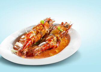 Prawns with sweet and spicy sauce served on a white plate. Isolated seafood cuisine.
