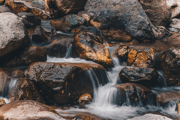 Fototapeta na wymiar waterfall on the rocks, stream mountain