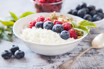 cottage cheese, muesli and fresh fruit for breakfast, selective focus