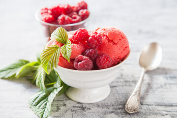 raspberry ice cream with berries, selective focus