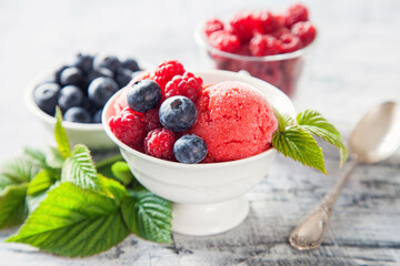 raspberry ice cream with berries, selective focus