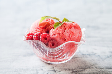 raspberry ice cream with berries, selective focus
