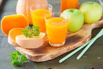 pumpkin apple juice in a glass, selective focus