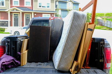 Trash items loaded on a truck to be disposed of at a landfill
