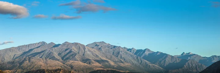 Schilderijen op glas Mountain landscape. Mountains sky panorama, Mountain landscape blue sky panoramic banner background. Nature mountain landscape. © Joshua