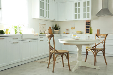Elegant kitchen interior design with white round table