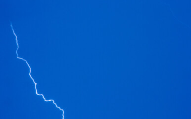 Lightning strike on the Blue sky background