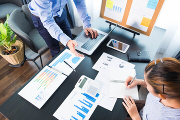 Businessmen present to the flipchart during the presentation of the earnings, consult the business...