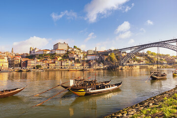 Fototapeta na wymiar Porto Portugal city skyline at Porto Ribeira and Douro River with Rabelo wine boat