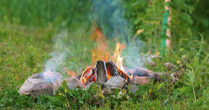 Graded shot of the burning bonfire, filmed with a super tele lens in C4K format