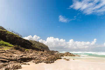coastline beach sand sea rock sunset