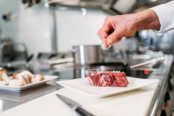 Preparing food in restaurant kitchen