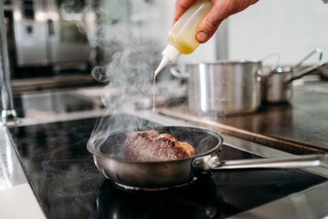 Preparing food in restaurant kitchen