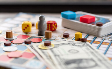 Board games, coins, bills, dice and cards