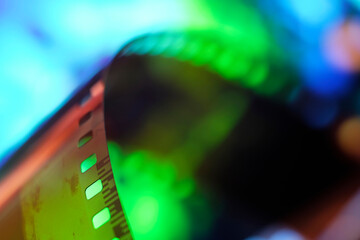 Color negative film in blur. 35mm negative film. Photographic film view with shallow depth of field.
