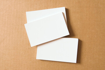 Business card on wooden background. Blank name card for company logo,  Branding Mock-up. Flat lay. Copy space for text       