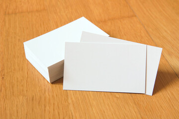 Business card on wooden background. Blank name card for company logo,  Branding Mock-up. Flat lay. Copy space for text       
