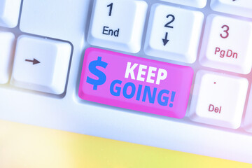 Writing note showing Keep Going. Business concept for to continue living normally despite the...