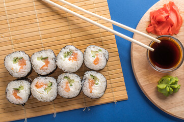 Sushi rolls set served on bamboo mat