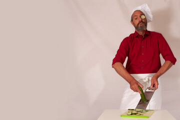 funny chef acting with vegetables
