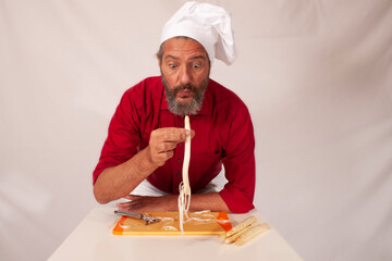 funny chef acting with vegetables