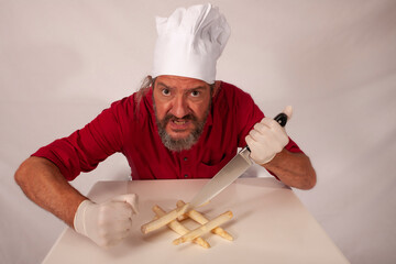 funny chef acting with vegetables