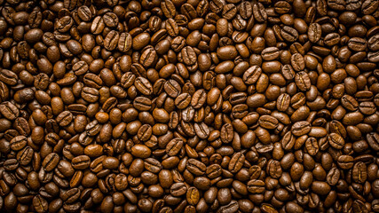 Top view of brown coffee beans background.