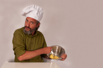 funny chef acting with vegetables
