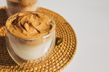 Dalgona Coffee, a trendy fluffy creamy whipped coffee in glass cups