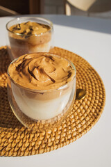 Dalgona Coffee, a trendy fluffy creamy whipped coffee in glass cups